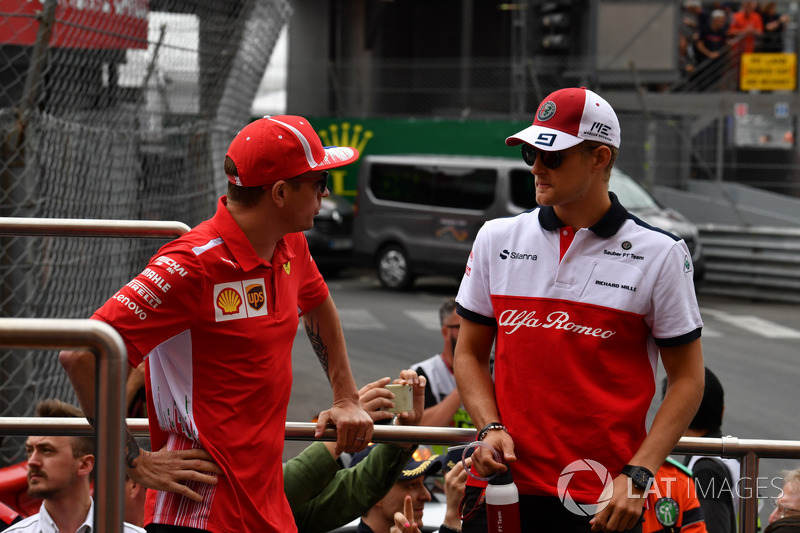 Kimi Raikkonen, Ferrari and Marcus Ericsson, Sauber on the drivers parade