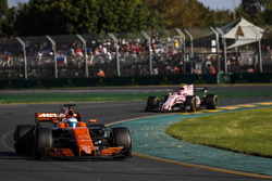 Fernando Alonso, McLaren MCL32, leads Esteban Ocon, Force India VJM10