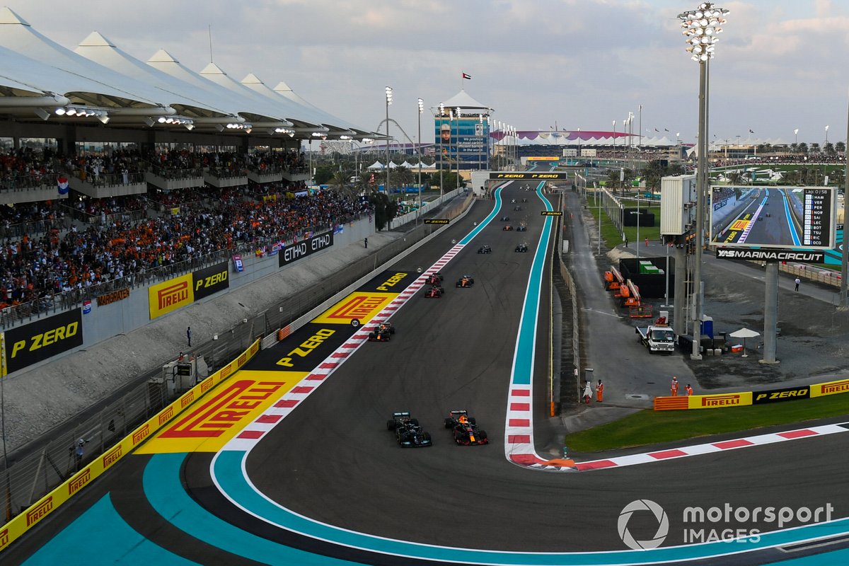 Max Verstappen, Red Bull Racing RB16B, battles with Lewis Hamilton, Mercedes W12, on the opening lap