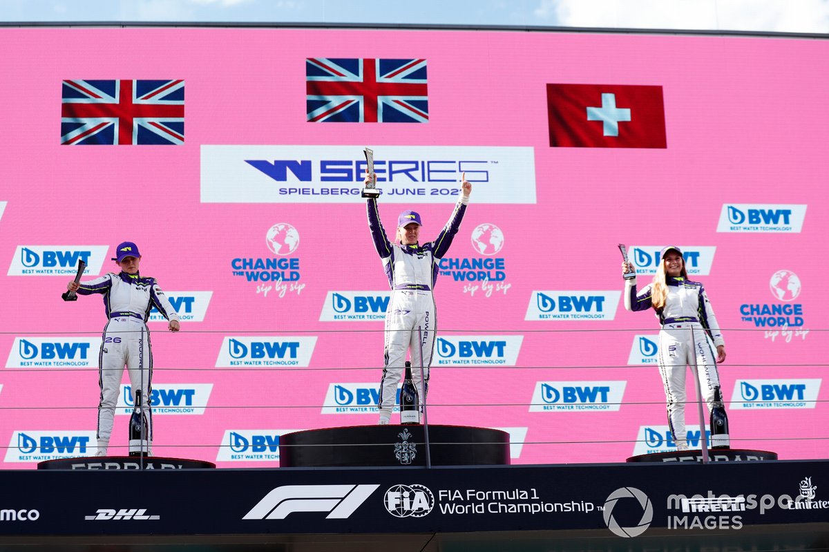 Sarah Moore, Alice Powell, and Fabienne Wohlwend celebrate on the podium