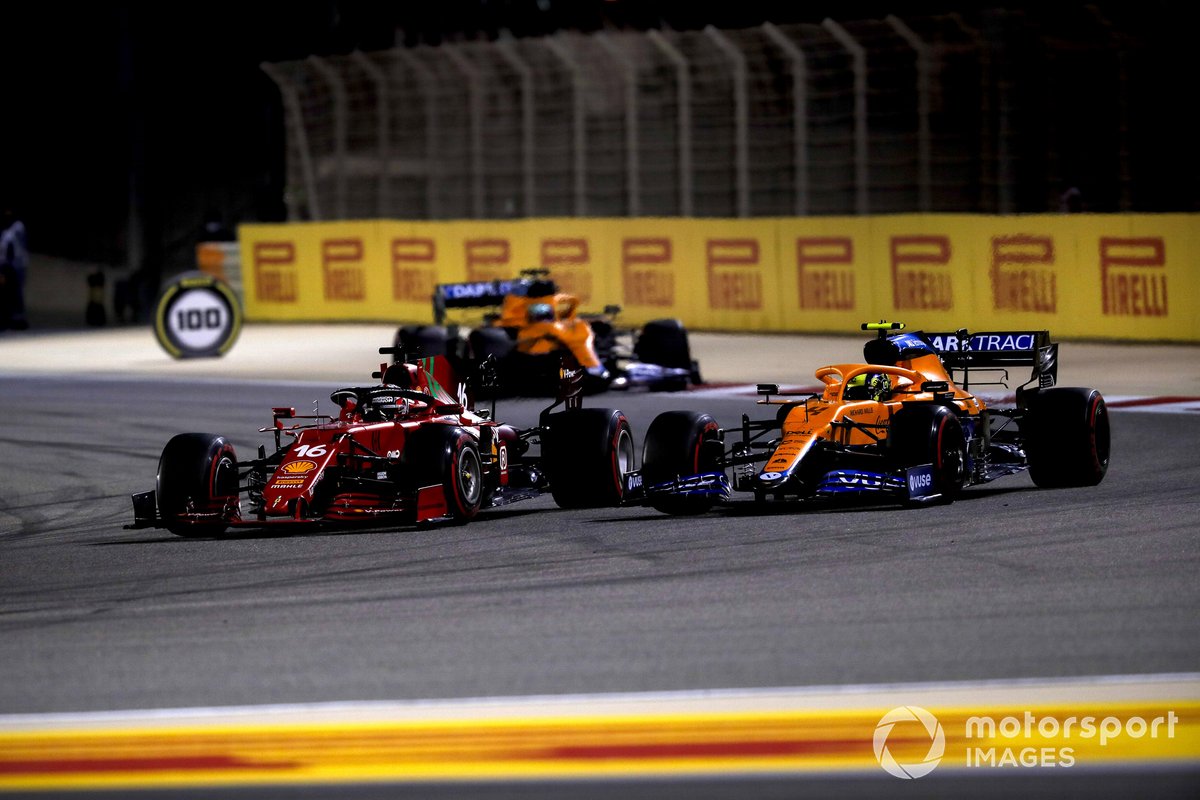 Charles Leclerc, Ferrari SF21, battles with Lando Norris, McLaren MCL35M, ahead of Daniel Ricciardo, McLaren MCL35M