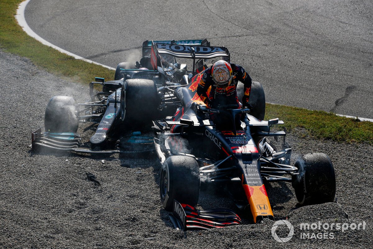 Lewis Hamilton, Mercedes W12, dan Max Verstappen, Red Bull Racing RB16B, crash out of the race