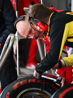 Jock Clear, Ferrari Engineering Director with a Pirelli Tyre Technician