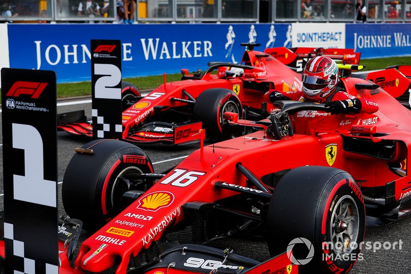 Charles Leclerc, Ferrari SF90, celebrates pole position, ahead of Sebastian Vettel, Ferrari SF90