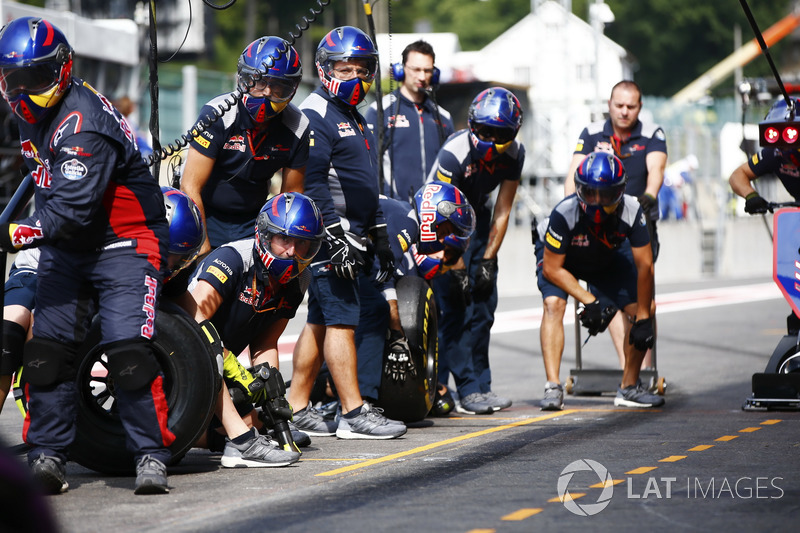 Scuderia Toro Rosso mechanics in the pit lane