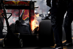 The brakes of Max Verstappen, Red Bull Racing RB12, catch fire in the pits