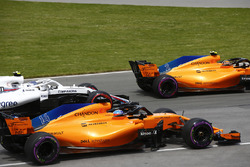 Stoffel Vandoorne, McLaren MCL33, leads Fernando Alonso, McLaren MCL33, and Sergey Sirotkin, William