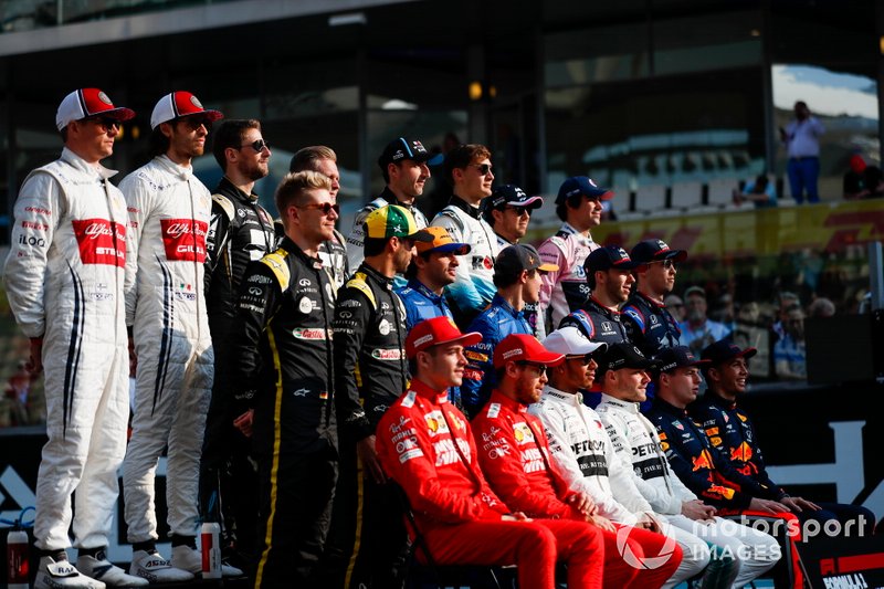 The class of 2019 pose for a final group photo. Back row L-R: Kimi Raikkonen, Alfa Romeo Racing, Antonio Giovinazzi, Alfa Romeo Racing, Romain Grosjean, Haas F1, Kevin Magnussen, Haas F1, Robert Kubica, Williams Racing, George Russell, Williams Racing, Sergio Perez, Racing Point, Lance Stroll, Racing Point. Middle row, L-R: Nico Hulkenberg, Renault F1 Team, Daniel Ricciardo, Renault F1 Team, Carlos Sainz Jr., McLaren MCL34, Lando Norris, McLaren, Pierre Gasly, Toro Rosso, and Daniil Kvyat, Toro Rosso. Middle row, L-R: Charles Leclerc, Ferrari, Sebastian Vettel, Ferrari, Lewis Hamilton, Mercedes AMG F1, Valtteri Bottas, Mercedes AMG F1, Max Verstappen, Red Bull Racing and Alexander Albon, Red Bull Racing