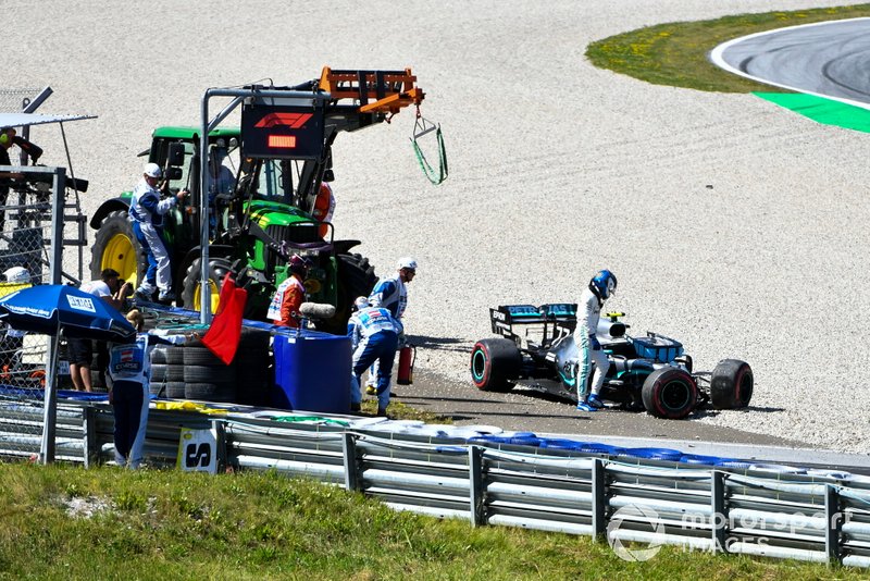 Valtteri Bottas, Mercedes AMG F1, climbs out of his damaged car after a crash in second practice