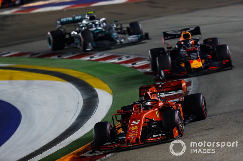 Sebastian Vettel, Ferrari SF90, leads Max Verstappen, Red Bull Racing RB15, and Valtteri Bottas, Mercedes AMG W10