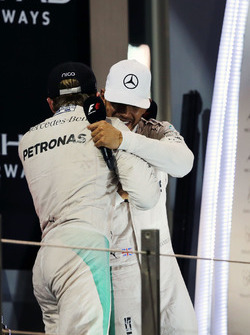 World Champion Nico Rosberg, Mercedes AMG F1 shakes hands with team mate and race winner Lewis Hamilton, Mercedes AMG F1
