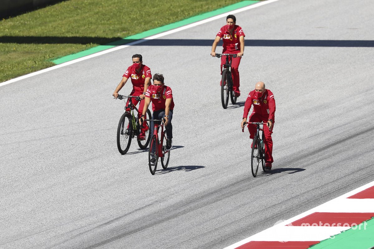 Charles Leclerc, Ferrari walks the track on a bike