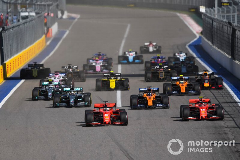 Sebastian Vettel, Ferrari SF90, overtakes Charles Leclerc, Ferrari SF90 at the start