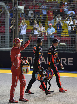 Pole sitter Sebastian Vettel, Ferrari, Daniel Ricciardo, Red Bull Racing and Max Verstappen, Red Bull Racing wave to the crowd in parc ferme