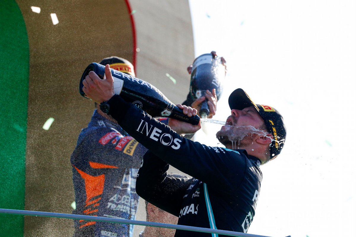 Valtteri Bottas, Mercedes, 3rd position, drinks Champagne on the podium