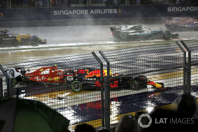 The cars of Kimi Raikkonen, Ferrari SF70H and Max Verstappen, Red Bull Racing RB13 crash and collide