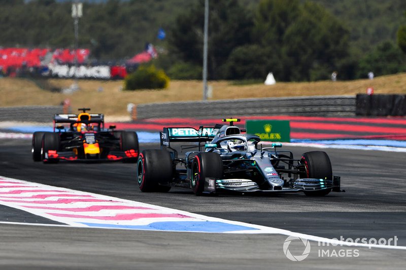Valtteri Bottas, Mercedes AMG W10, leads Max Verstappen, Red Bull Racing RB15