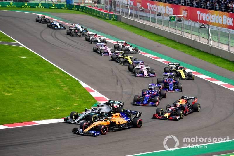 Lando Norris, McLaren MCL34, leads Valtteri Bottas, Mercedes AMG W10, Max Verstappen, Red Bull Racing RB15, Daniil Kvyat, Toro Rosso STR14, Pierre Gasly, Toro Rosso STR14, Daniel Ricciardo, Renault F1 Team R.S.19, and the remainder of the field at the start