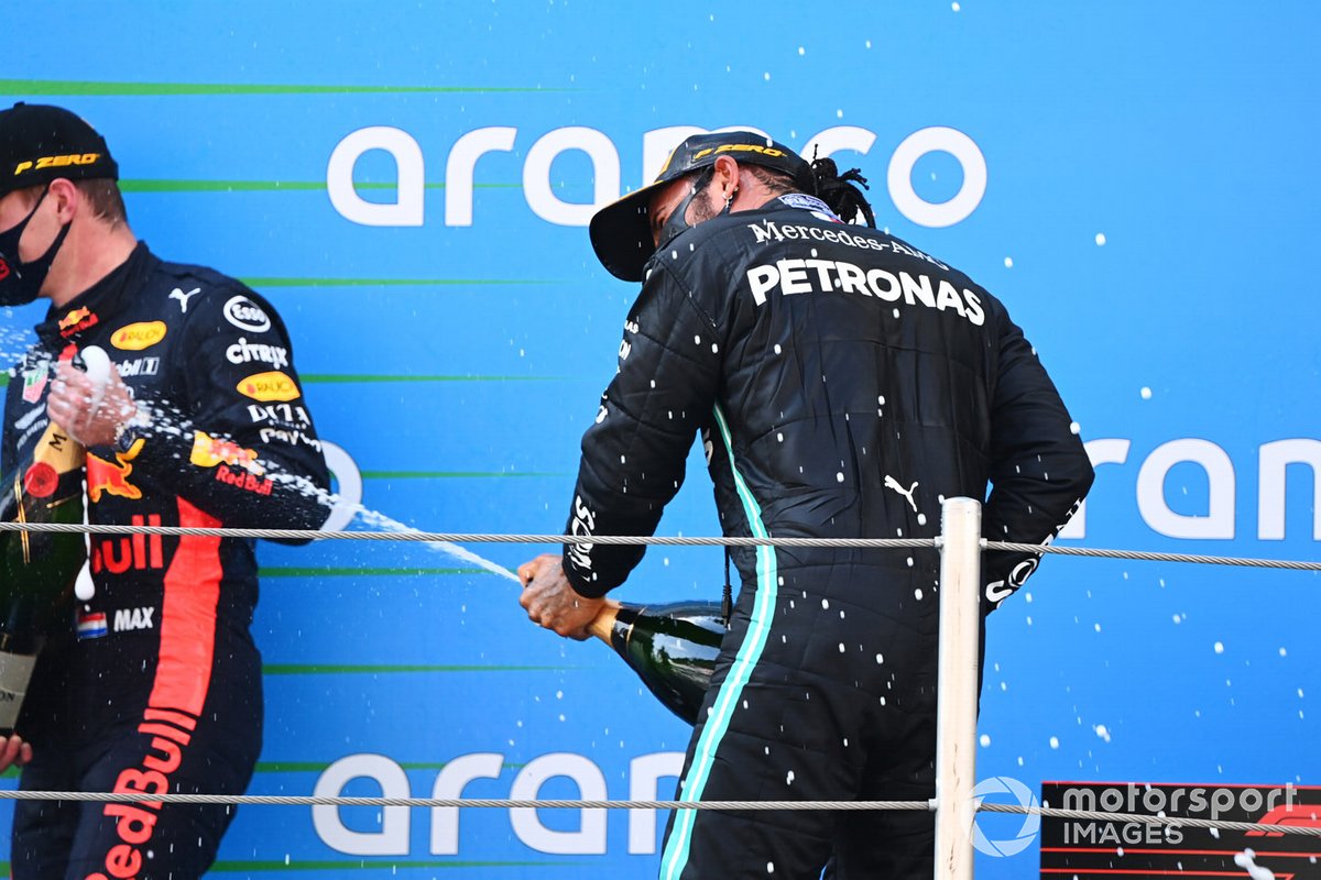 Max Verstappen, Red Bull Racing, 2nd position, Lewis Hamilton, Mercedes-AMG Petronas F1, 1st position, celebrate with Champagne