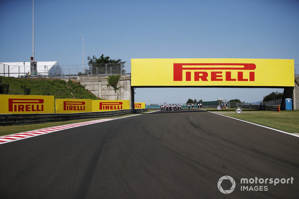 Pirelli advertising branding on a bridge and trackside