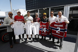 Fernando Alonso, McLaren, and Stoffel Vandoorne, McLaren, swap shirts with hockey players, including