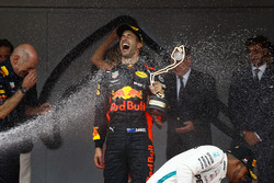 Race winner Daniel Ricciardo, Red Bull Racing, is sprayed by champagne on the podium with Adrian Newey, Chief Technical Officer, Red Bull Racing, and Lewis Hamilton, Mercedes AMG F1