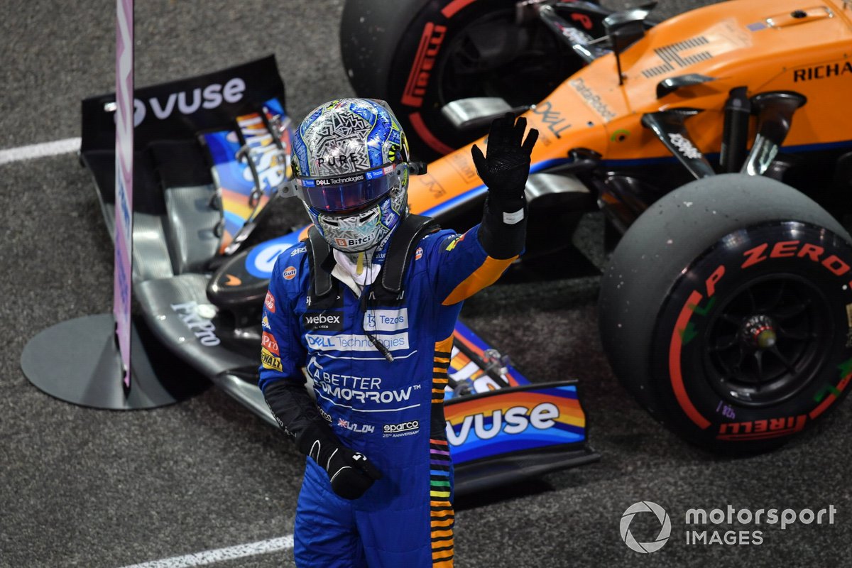 Lando Norris, McLaren, waves from the grid after securing third in Qualifying