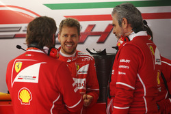 Sebastian Vettel, Ferrari, talks to Maurizio Arrivabene, Team Principal, Ferrari and a team mate