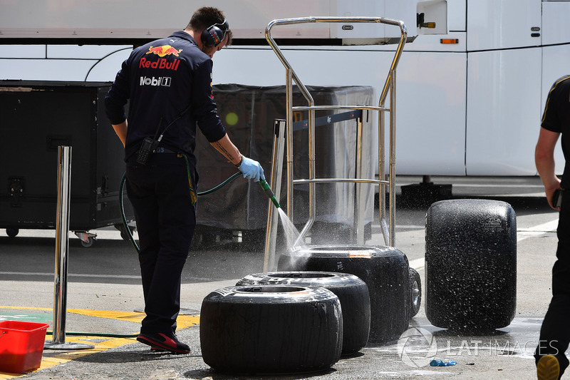 Red Bull Racing mechanic washes Pirelli tyres