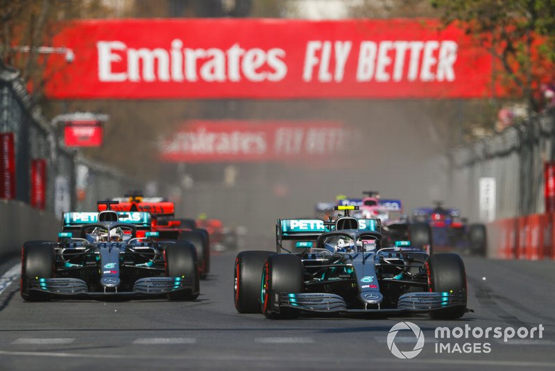 Valtteri Bottas, Mercedes AMG W10 and Lewis Hamilton, Mercedes AMG F1 W10 battle on lap1