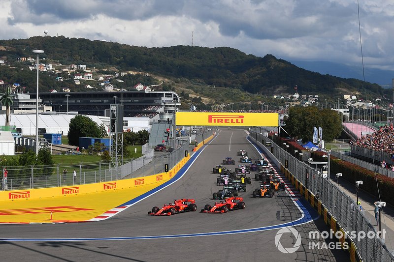 Sebastian Vettel, Ferrari SF90, leads Charles Leclerc, Ferrari SF90, Lewis Hamilton, Mercedes AMG F1 W10, Carlos Sainz Jr., McLaren MCL34, Valtteri Bottas, Mercedes AMG W10, Lando Norris, McLaren MCL34, and the rest of the field at the start of the race