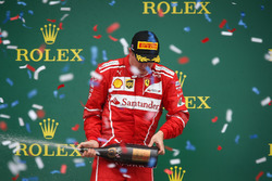 Kimi Raikkonen, Ferrari celebrates on the podium, the champagne