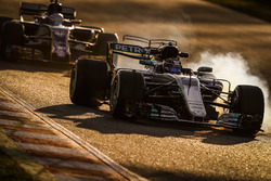 Valtteri Bottas, Mercedes F1 W08, leads Antonio Giovinazzi, Sauber C36
