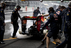 The brakes of Max Verstappen, Red Bull Racing RB12, catch fire in the pits