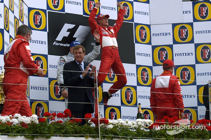 2004. Подіум: 1. Міхаель Шумахер, Ferrari. 2. Кімі Райкконен, McLaren-Mercedes, 3. Рубенс Баррікелло, Ferrari