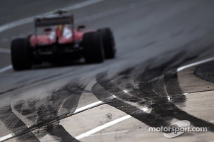 Felipe Massa, Ferrari F138 passes tyre rubber on the pit exit