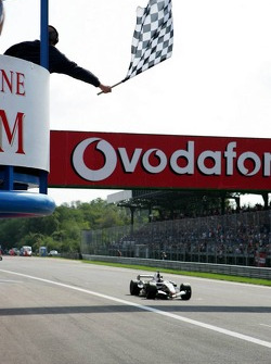 Juan Pablo Montoya takes the checkered flag