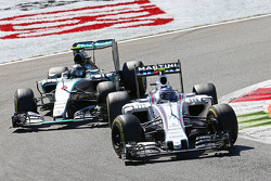Valtteri Bottas, Williams FW37 and Nico Rosberg, Mercedes AMG F1 W06 battle for position