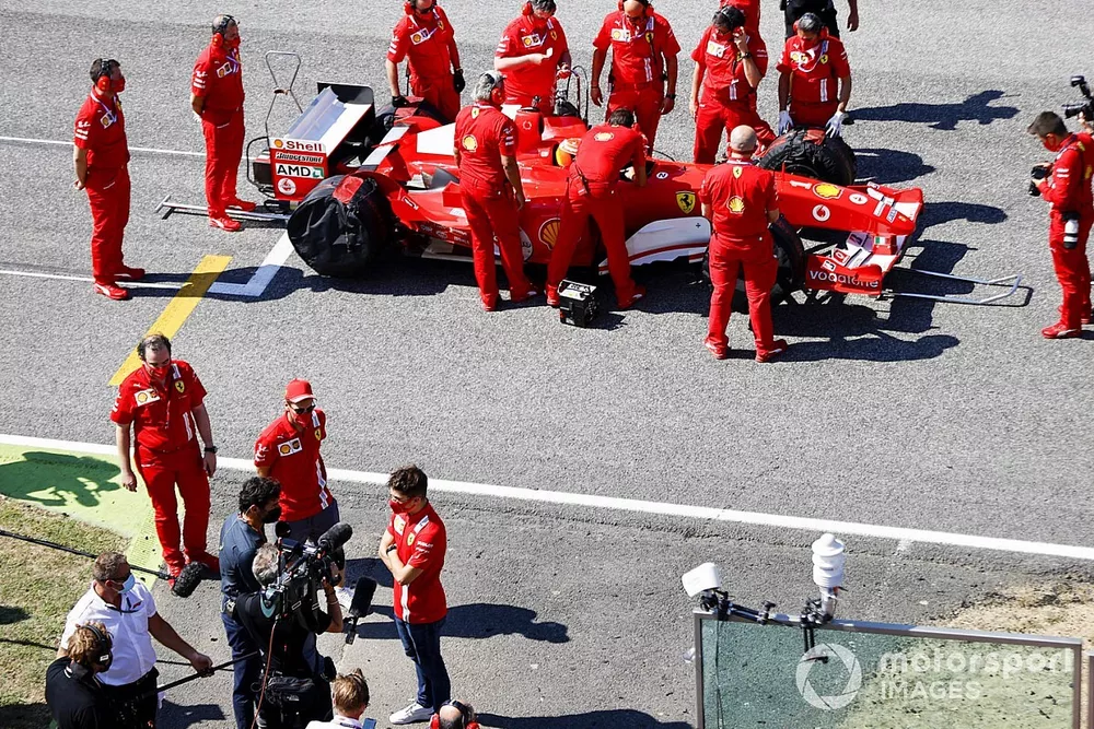 Charles Leclerc, Ferrari, is interviewed as the Ferrari team prepare Mick Schumacher to drive his fathers championship winning Ferrari F2004