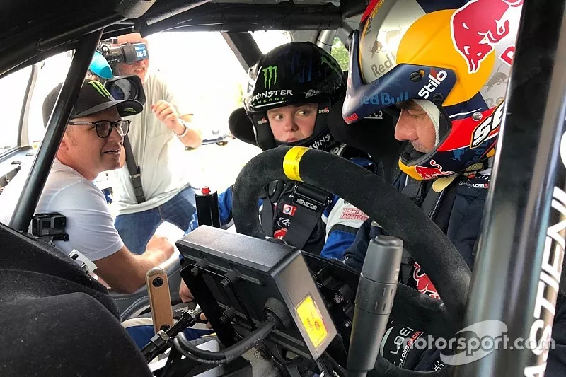Sebastien Loeb tutoring Oliver Solberg, with Petter Solberg watching on