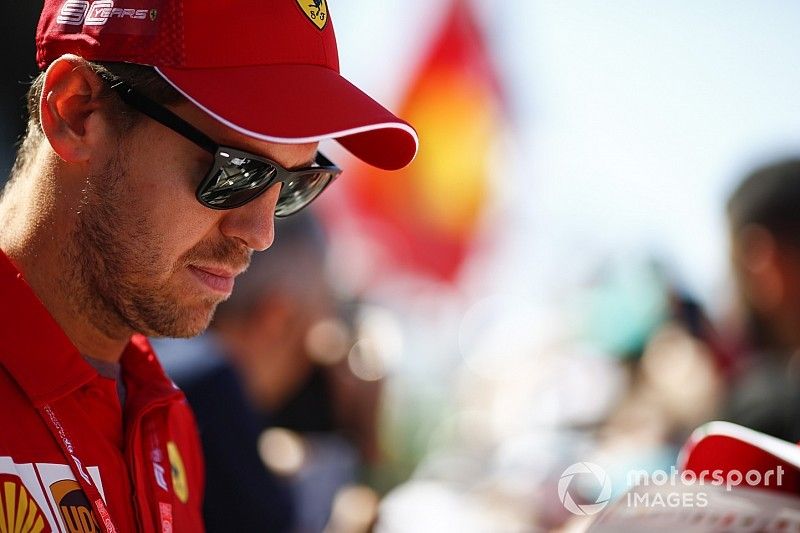 Sebastian Vettel, Ferrari signs a autograph for a fan 