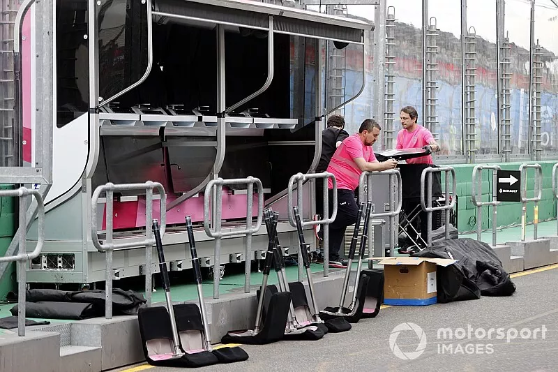Racing Point personnel pack away their equipment on the pitwall