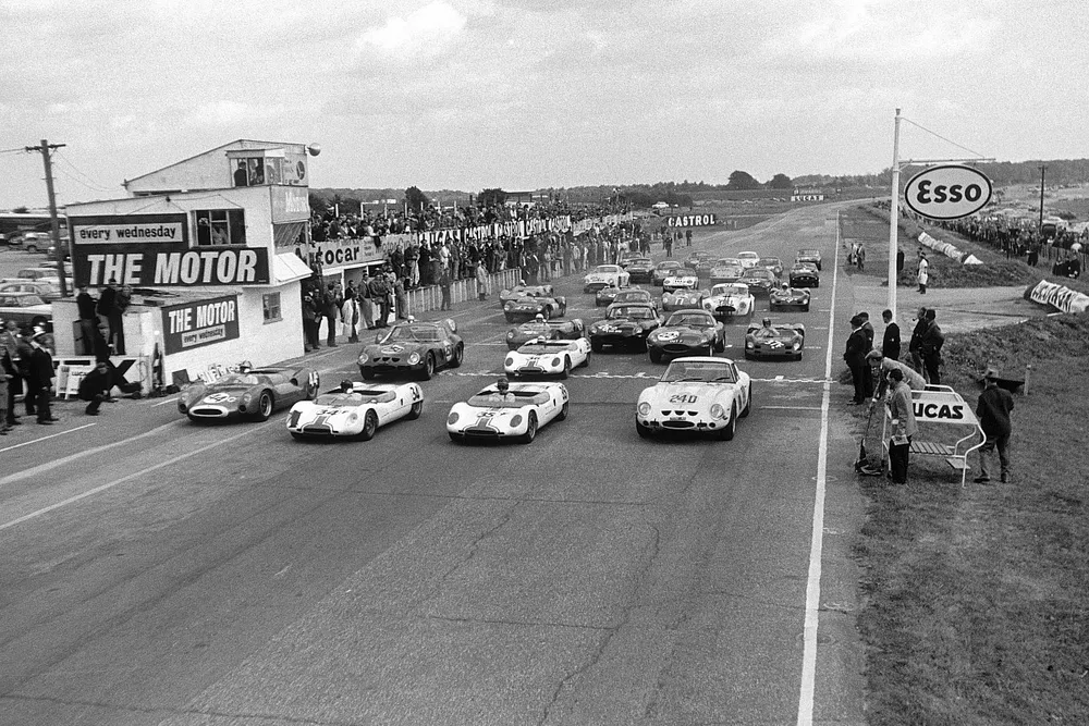 Roy Salvadori, Cooper Monaco T61 Climax Jim Clark Lotus 23B Ford, Tony Hegbourne, Loyus 23B Ford, and Jack Sears, Ferrari 250 GTO, at the start of the race, 