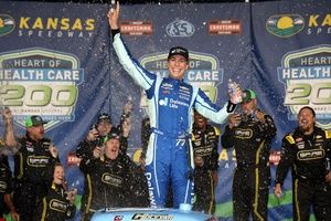 With a middle finger out the window, Carson Hocevar wins Kansas Truck race