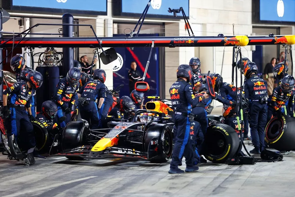 Sergio Perez, Red Bull Racing RB20, makes a pit stop