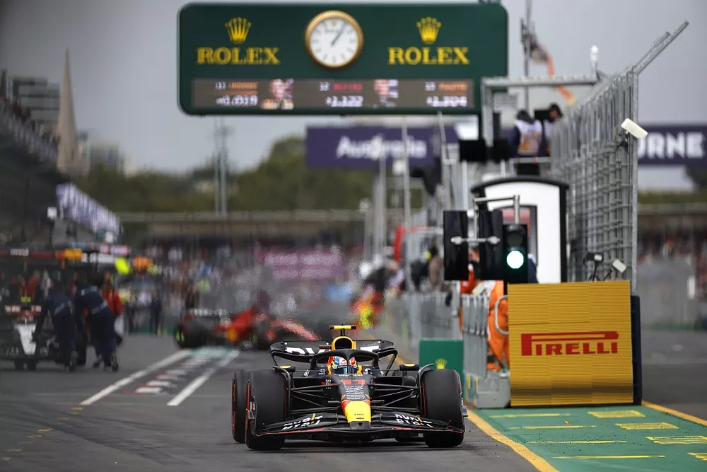 Sergio Perez, Red Bull Racing RB19, leaves the pit lane