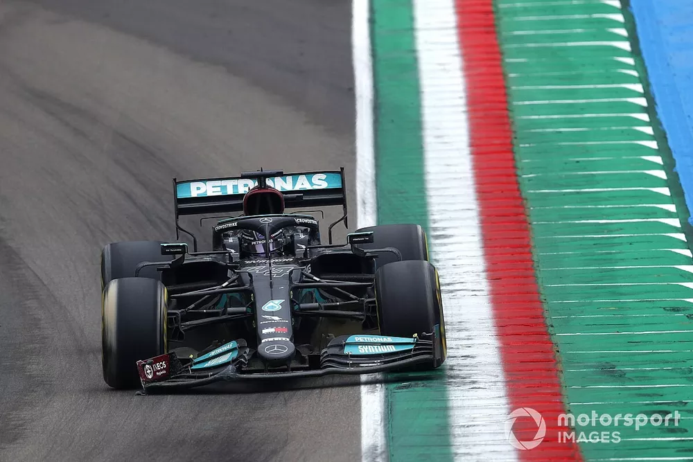 Lewis Hamilton, Mercedes W12, heads to the pits with a broken front wing