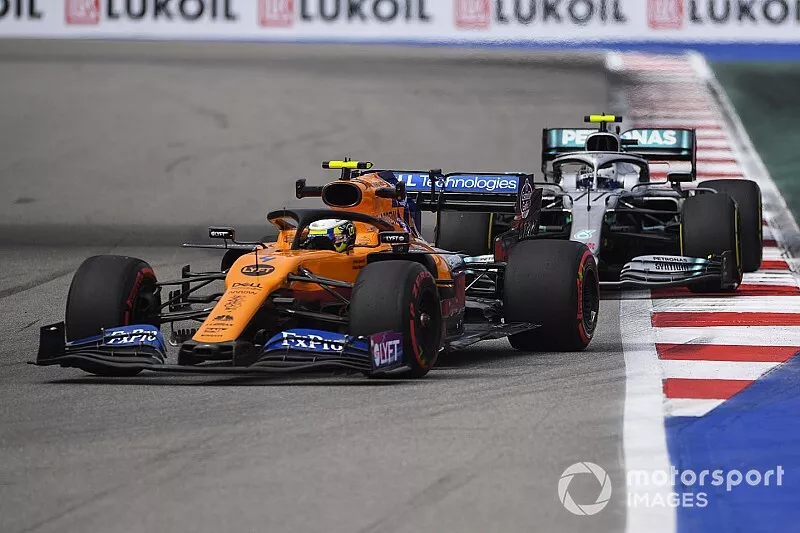 Lando Norris, McLaren MCL34, leads Valtteri Bottas, Mercedes AMG W10  