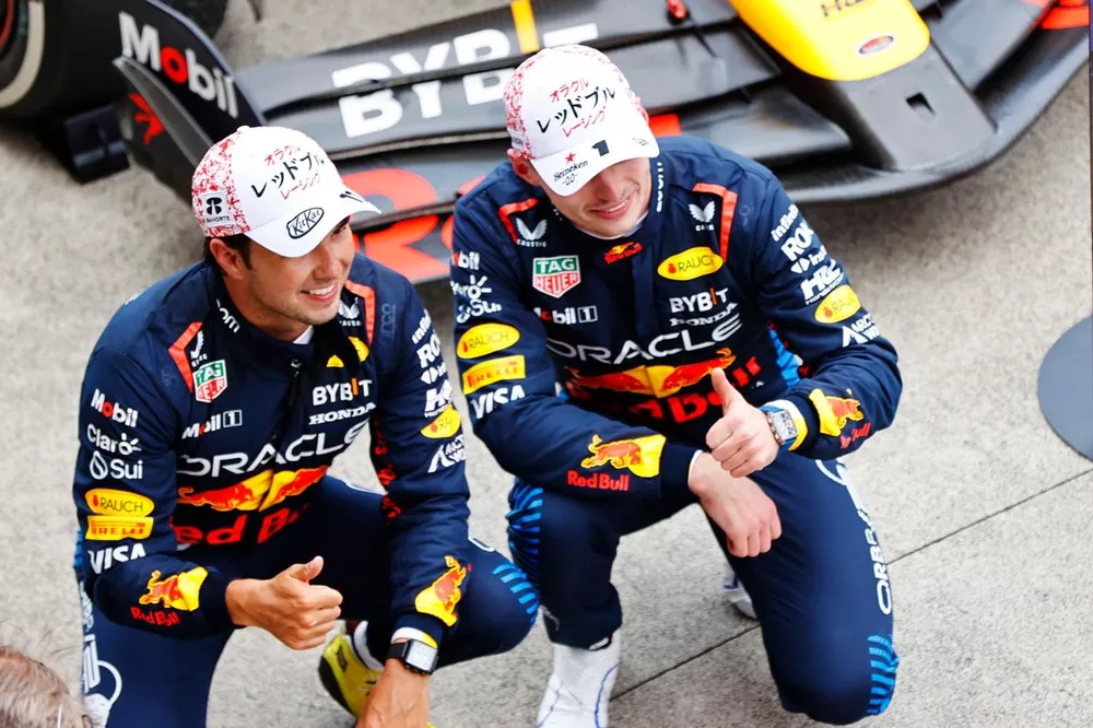 Sergio Perez, Red Bull Racing, 2nd position, and Max Verstappen, Red Bull Racing, 1st position, pose for a picture togerther in Parc Ferme 