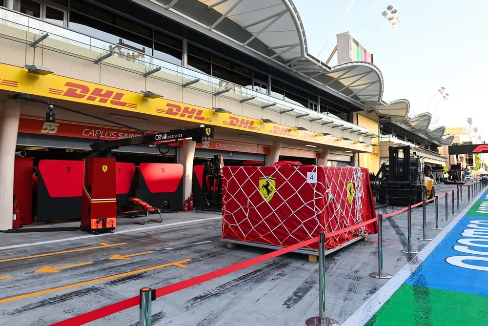 Freight sits outside of the Ferrari garage in the pit lane